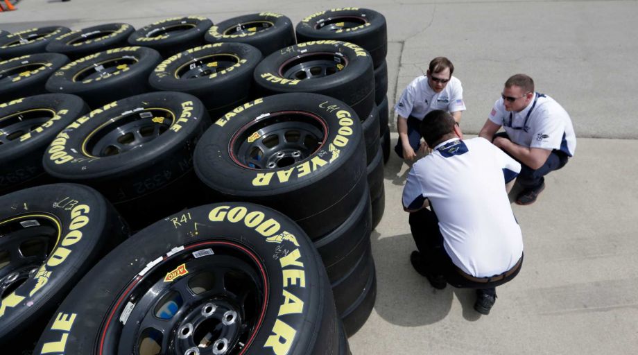 Goodyear tire technical officials discuss tires at the Texas Motor Speedway in Fort Worth Texas. Goodyear reports quarterly financial results on Wednesday