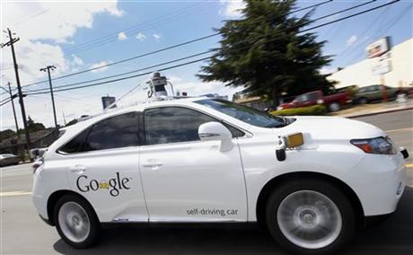 Google's self-driving Lexus car drives along street during a demonstration at Google campus in Mountain View Calif