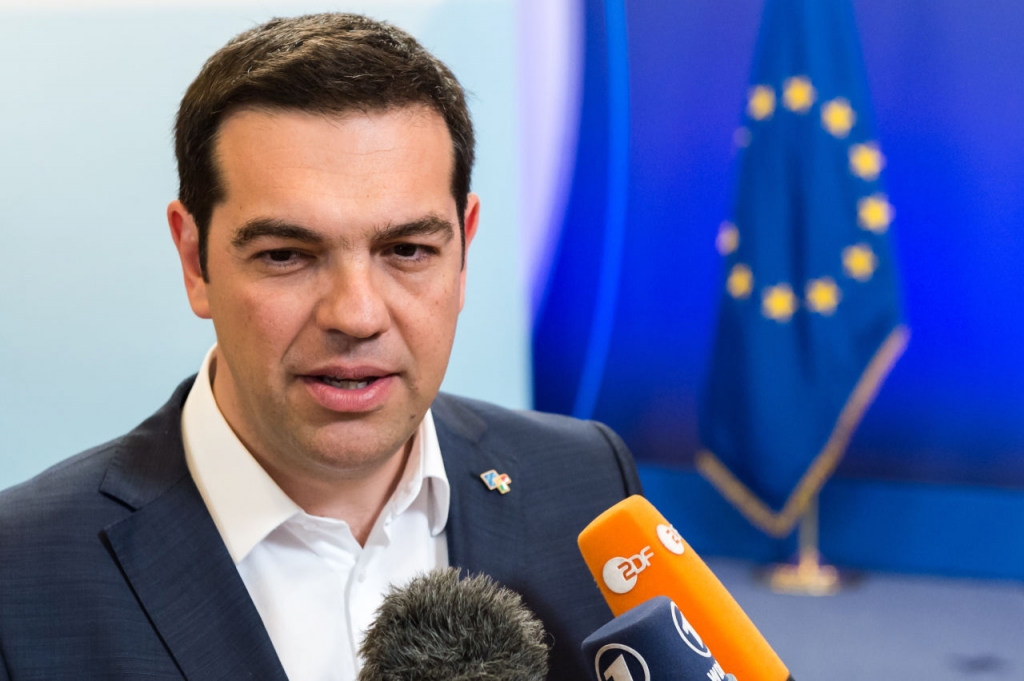 Greek Prime Minister Alexis Tsipras talks to the media as he leaves after he participated in a bilateral meeting with European Commission President Jean Claude Juncker on the sidelines of the EU meetings in Brussels on Thursday