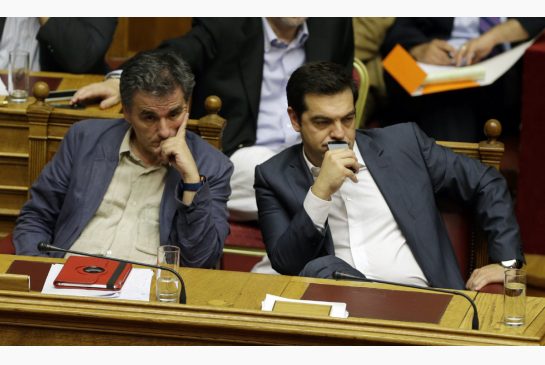 Greece's Prime Minister Alexis Tsipras right and Finance Minister Euclid Tsakalotos attend a parliament meeting in Athens Thursday