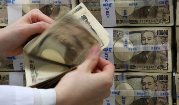 The yen was briefly on the defensive after the International Monetary Fund warned Japan to avoid over-reliance on a weak currency to reflate its economy