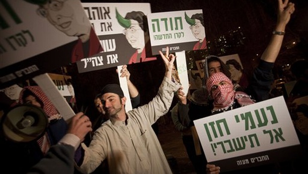 30 2010 Jewish right-wing activists dressed as Arabs demonstrate against the New Israel Fund organization committed to democratic change within Israel social justice and equality for all Israelis Jerusalem