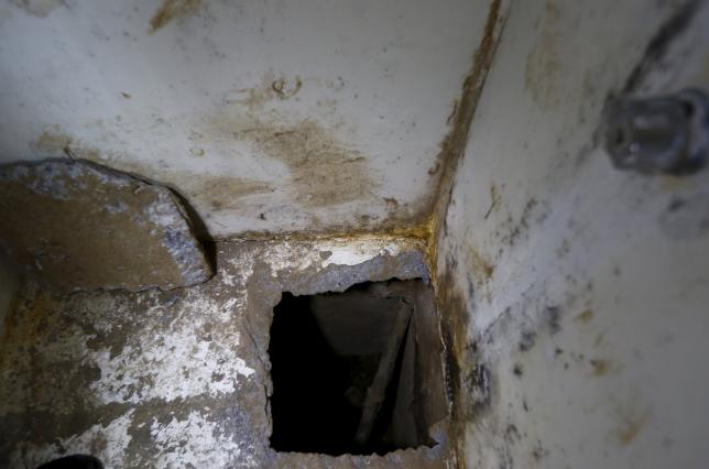 A view of the opening of a tunnel which is connected to a warehouse inside drug lord Joaquin'El Chapo Guzman's cell in the Altiplano Federal Penitentiary where he escaped from in Almoloya de Juarez on the outskirts of Mexico City