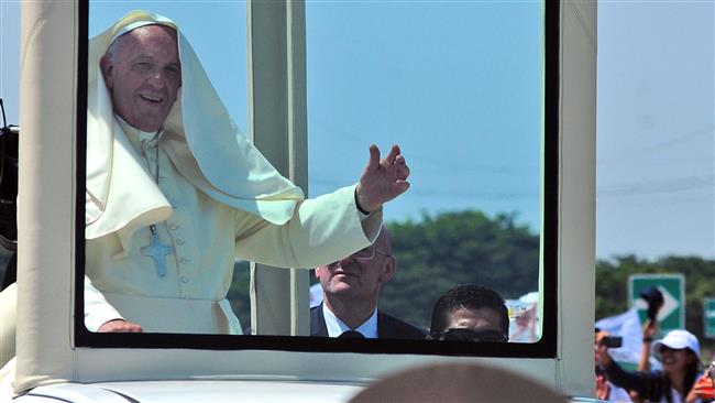 Pope Francis waves at a crowd of people in Guayaquil Ecuador