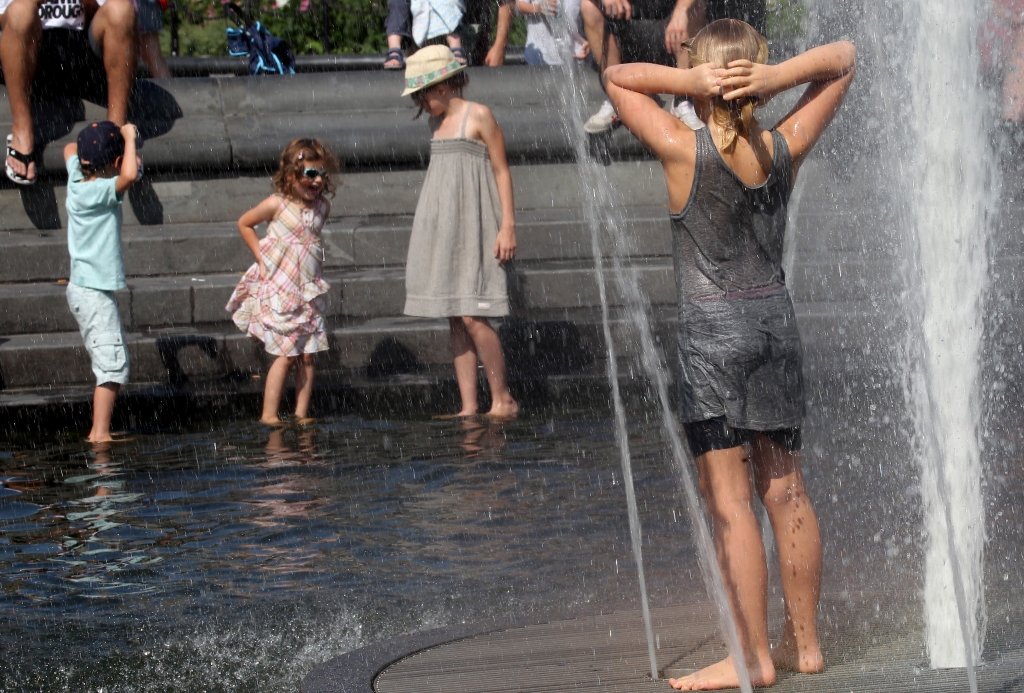 If you need to be outside Sunday afternoon make sure you keep cool like these New Yorkers seen in 2013