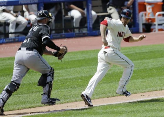 Cleveland Indians Brandon Moss right looks back