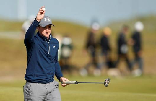 Paul Dunne of Ireland reacts after his birdie putt on the 15th hole during the third round of the British Open golf championship on the Old Course in St. Andrews