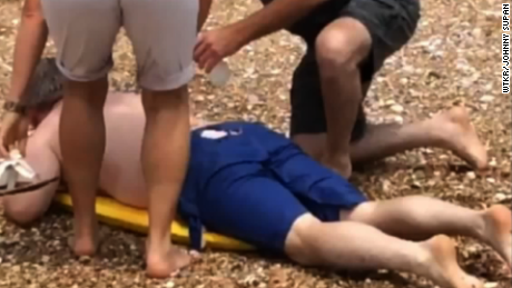 Man bitten by shark while protecting children