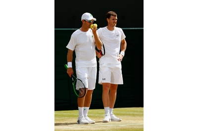 Jamie Murray and John Peers in doubles action against Alexander Peya of Austria and Bruno Soares of Brazil at Wimbledon