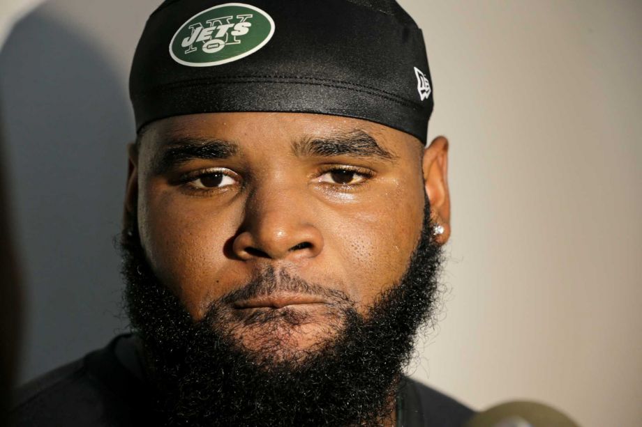 New York Jets defensive end Sheldon Richardson responds to questions during a news interview after practice at training camp Thursday