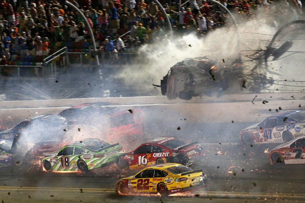 Austin Dillon driver of the #3 Bass Pro Shops Chevrolet is involved in an on-track incident following the checkered flag during the NASCAR Sprint Cup Series Coke Zero 400 Powered by Coca Cola at Daytona International Speedway