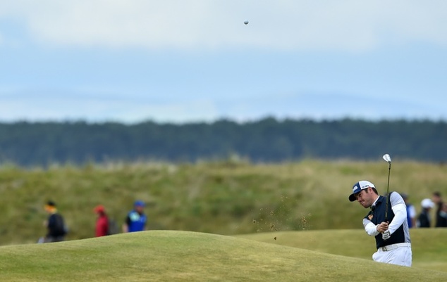 South Africa's Louis Oosthuizen chips on the 12th hole during the third round of the Open Championship at St Andrews in Scotland