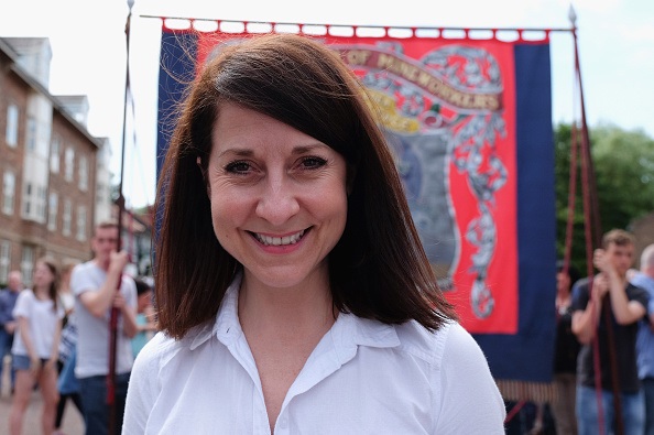 DURHAM ENGLAND- JULY 11 Labour leadership candidate Liz Kendall joins the march with the Fishburn Colliery Banner from Sedgefield during the annual Durham Miners Gala