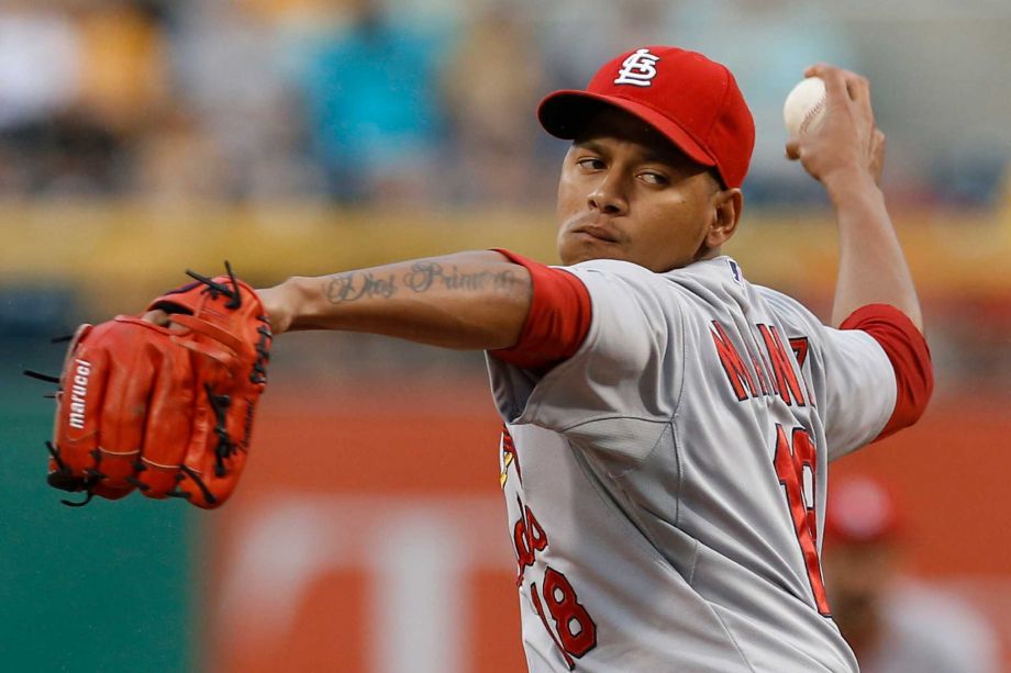 St. Louis Cardinals starting pitcher Carlos Martinez throws against the Pittsburgh Pirates during the first inning of a baseball game Thursday