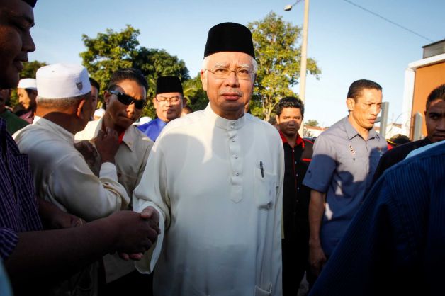 Malaysian Prime Minister Najib Razak arrives for a Ramadan breakfast at a mosque in Semenyih outside Kuala Lumpur Malaysia on Sunday