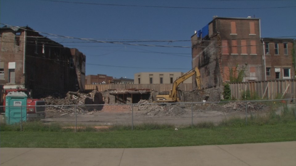 Buildings that stood in North Vernon Indiana for more than a century are now coming down because of a massive fire that devastated downtown last NOvember