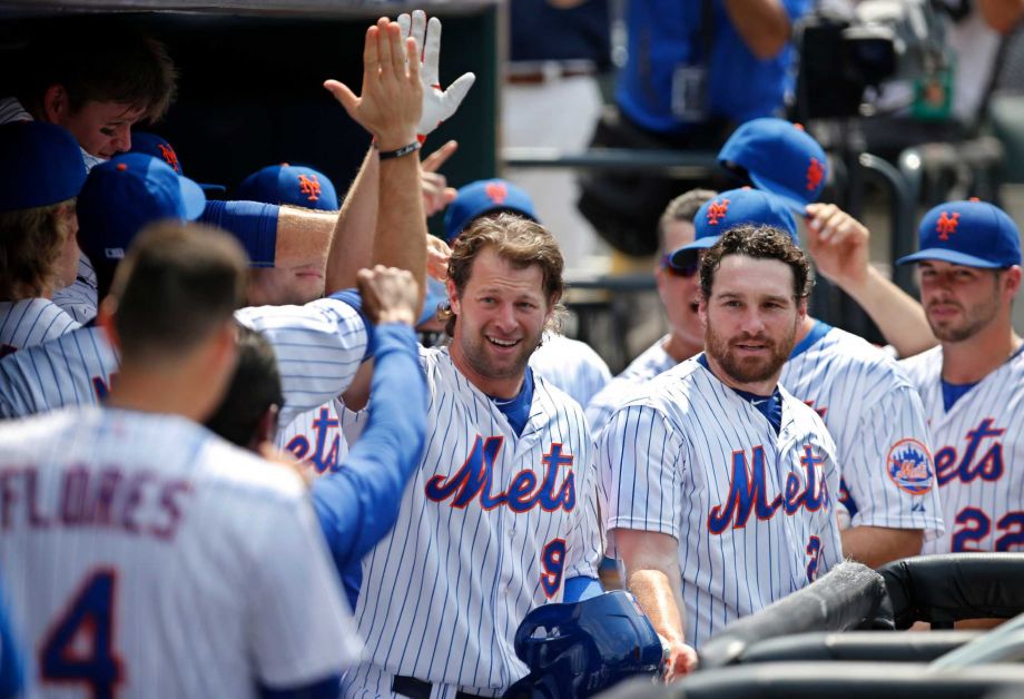 Teammates congratulate New York Mets Kirk Nieuwenhuis after his fifth-inning solo home run his third home run of the day in a baseball game against the Arizona Diamondbacks in New York Sunday