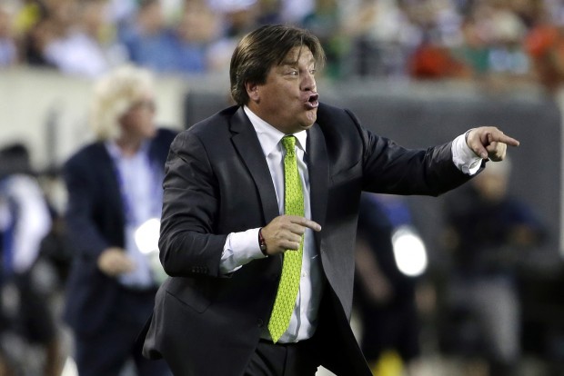 Mexico head coach Miguel Herrera yells during the first half of the CONCACAF Gold Cup championship soccer match against Jamaica Sunday
