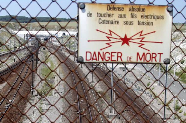 Migrant dies on freight train in Eurotunnel trying to reach Britain


Tunnel death A warning sign on the French side of the EuroTunnel