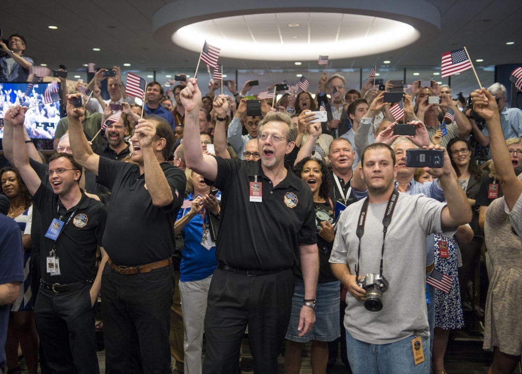 Moment NASA’s New Horizons team members count down to the spacecraft’s approach to Pluto on Tuesday