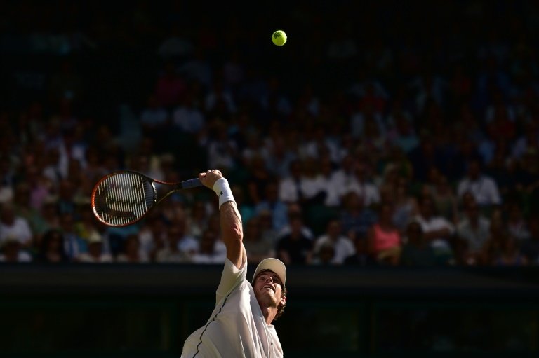 Britain's Andy Murray serves against Kazakhstan's Mikhail Kukushkin during their men's singles first round match on day two of the Wimbledon Championships