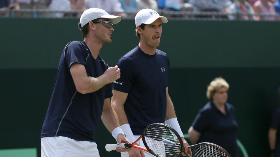 Britain's Andy Murray right and Jamie Murray during their doubles match against France's Jo Wilfried Tsonga and Nicolas Mahut during the quarterfinal match of the Davis Cup at the Queen's Club in London Saturday