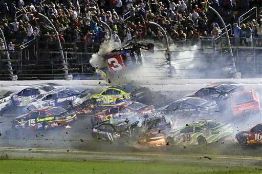 Austin Dillon goes airborne and hits the catch fence as he was involved in a multi-car crash on the final lap of the NASCAR Sprint Cup series auto race at Daytona International Speedway Monday