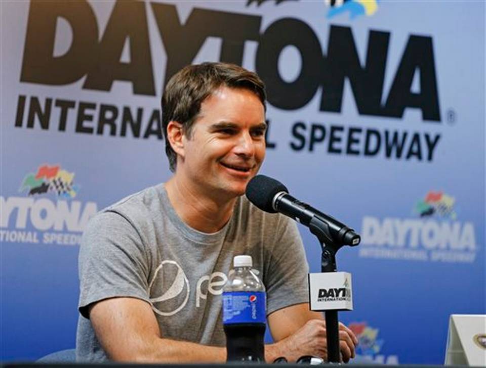 Jeff Gordon answers questions during a news conference after qualifying for the NASCAR Sprint Cup Series was canceled at Daytona International Speedway Saturday