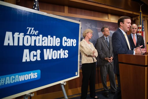 Sen. Chris Murphy D-Conn. second from right accompanied by Sen. Tammy Baldwin D-Wisc. left Sen. Sherrod Brown D-Ohio second from left and Sen. Bob Casey D-Pa. right speaks at a press conference on the positive affects of the Affordable Care Ac