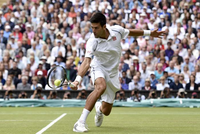 Novak Djokovic of Serbia hits a shot during his Men's Singles Final match against Roger Federer of Switzerland at the Wimbledon Tennis Championships in London