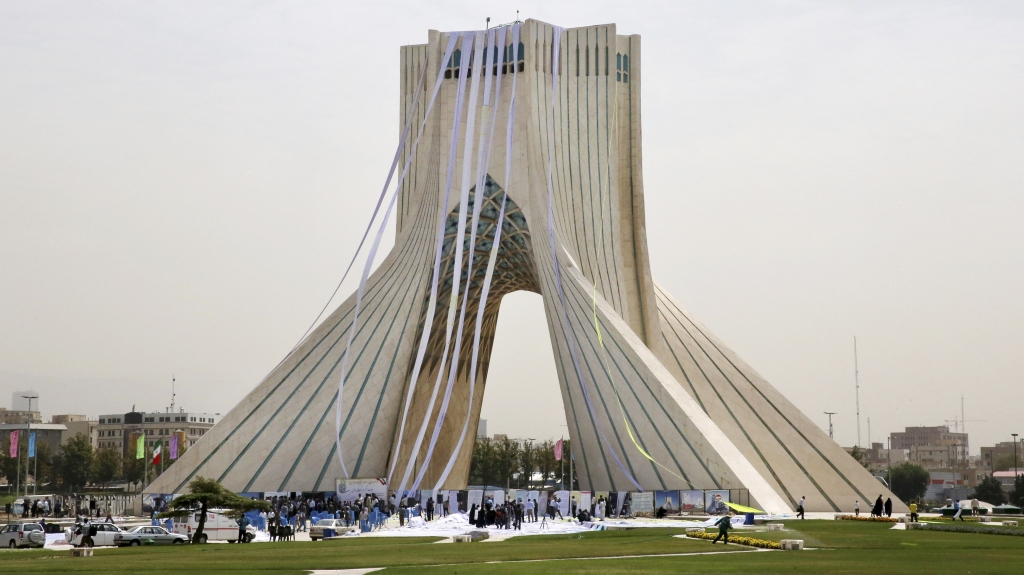 Iranian hard-liners hang petitions from the Azadi Tower in Tehran during a June 30 demonstration demanding a'good deal in the nuclear negotiations between Iran and six world powers. Negotiators announced a deal Tuesday morning in Vienna