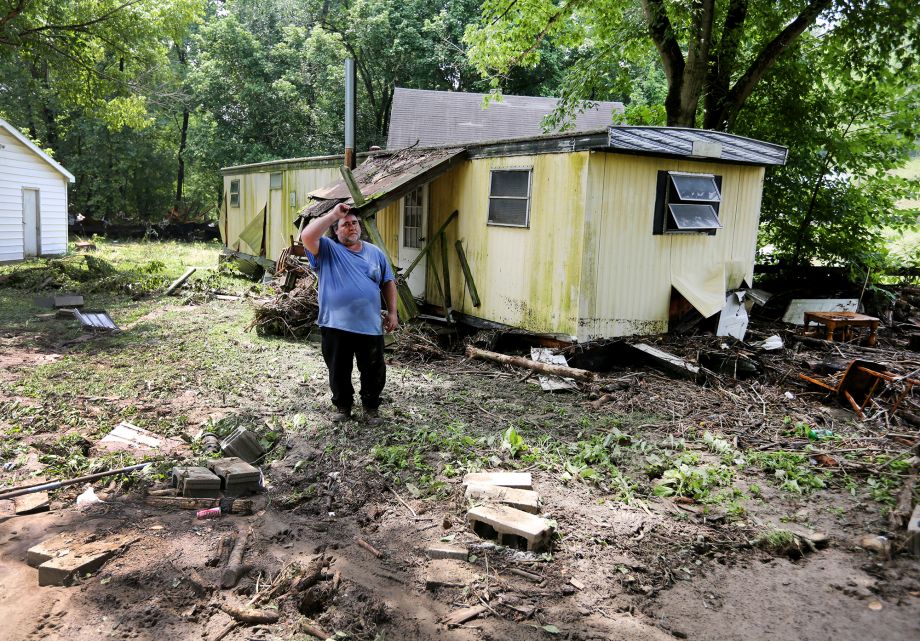 Downing's mobile home had previously been in the foreground where the bricks are prior to a late evening flash flood. The flood swept away a mobile home late Saturday killing