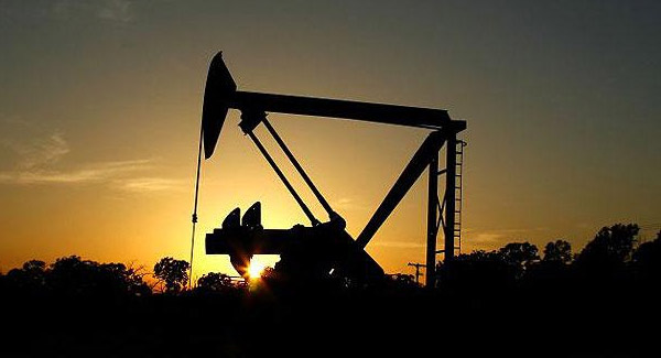 Oil prices edge lower on stronger dollar ample supply