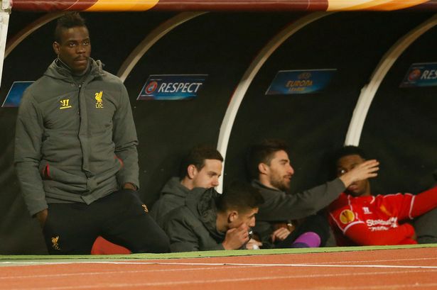 Out in the cold Liverpool's Mario Balotelli watches from the bench