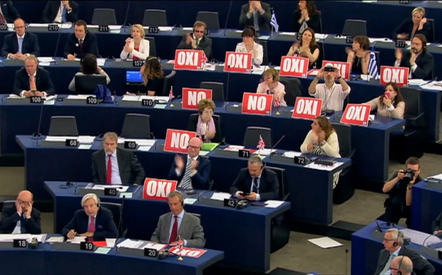 Oxi and No signs displayed by MEPs as Tsipras gave his speech