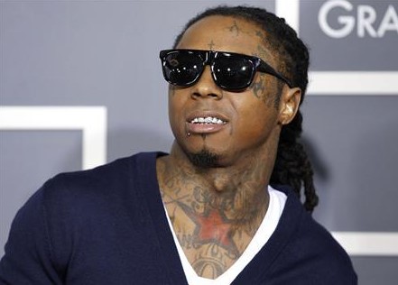 Rapper Lil Wayne poses on arrival at the 53rd annual Grammy Awards in Los Angeles California in this