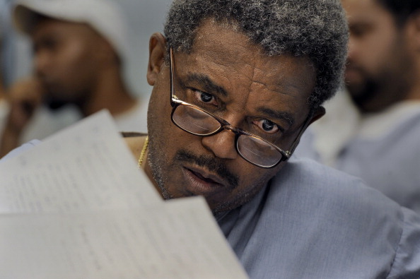 JESSUP MD AUGUST 24: Inmate Fortunado Medes goes over handouts from the philosophy class offered at the prison. Inmates at the Jessup Correctional Institution attended a class in philosophy taught by Professor Donald McColl