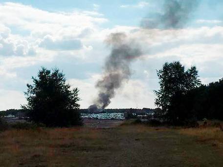 Taken with permission from the Twitter feed@NathanGFilm of smoke rising from Blackbushe airport after a light aircraft crashed into a car auction shortly after take-off.
Nathan Greenwood  PA Wire