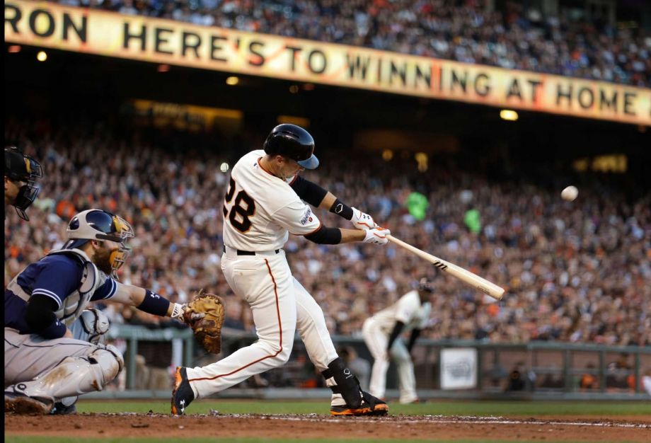 San Francisco Giants Buster Posey connects for a grand slam off San Diego Padres Ian Kennedy in the third inning of a baseball game Wednesday