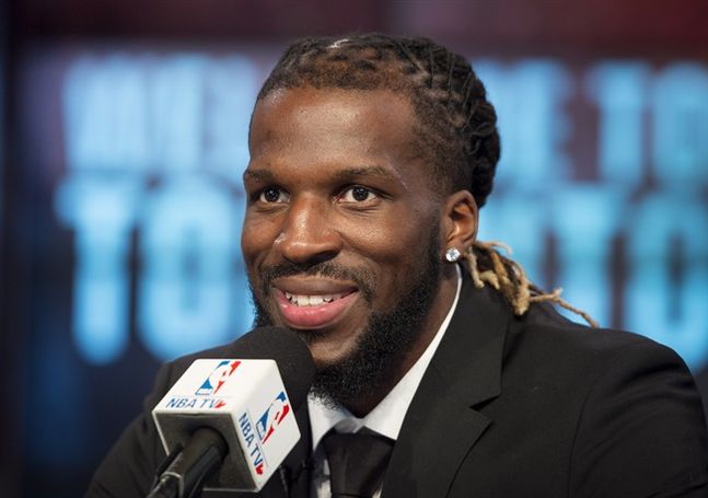 Toronto Raptors De Marre Carroll smiles during an introductory press conference in Toronto on Thursday