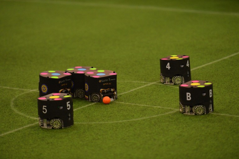 Robots compete during a match at the Robo Cup 2015 in Hefei east China's Anhui province