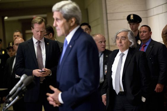 John Kerry accompanied by Secretary of Energy Ernest Moniz third from right gives brief remarks to members of the media before attending a classified briefing for all House members on Capitol Hill in Washington Wednesday Ju