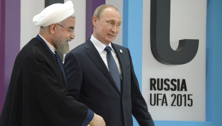 Russia's President Vladimir Putin welcomes Iran's President Hassan Rouhani during the 7th BRICS summit in Ufa