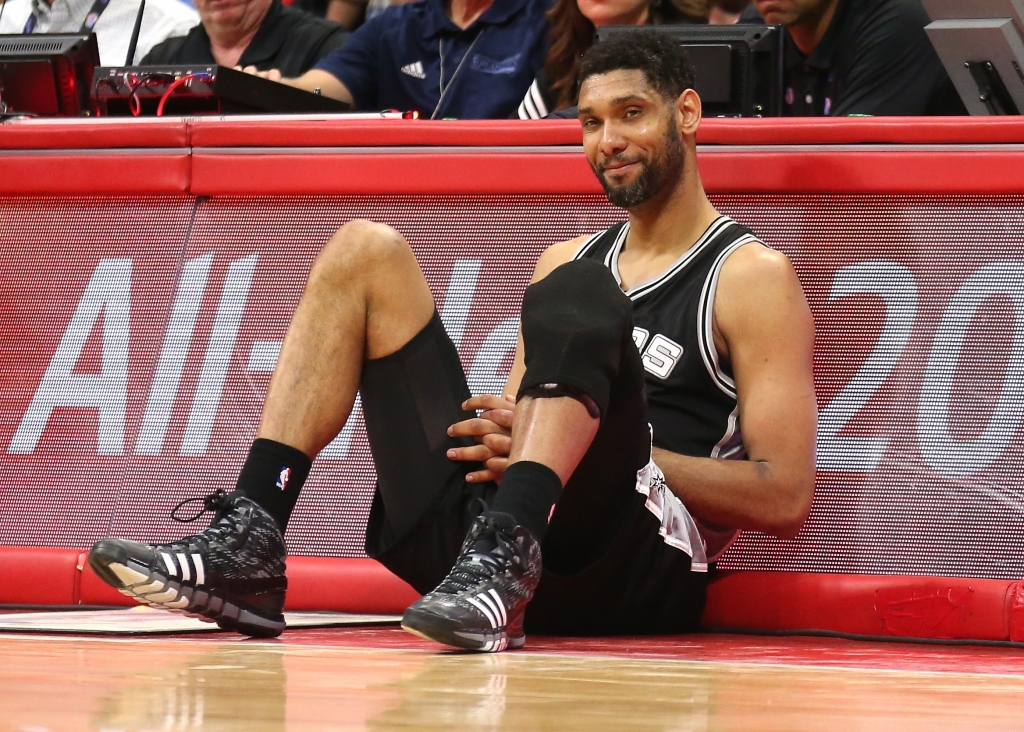 LOS ANGELES CA- MAY 02 Tim Duncan #21 of the San Antonio Spurs as he sits by the scorer's table waiting to enter the game against the Los Angeles Clippers during Game Seven of the Western Conference quarterfinals of the 2015 NBA Playoffs at Staple