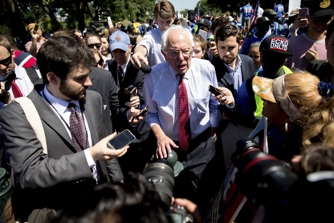 Democratic presidential candidate Sen. Bernie Sanders I-Vt. speaks to reporters after speaking to federal contract workers at a rally on Capitol Hill in Washington Wednesday