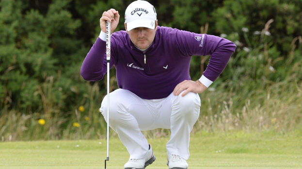 Scotland's Marc Warren eyes up the putt on the 9th green