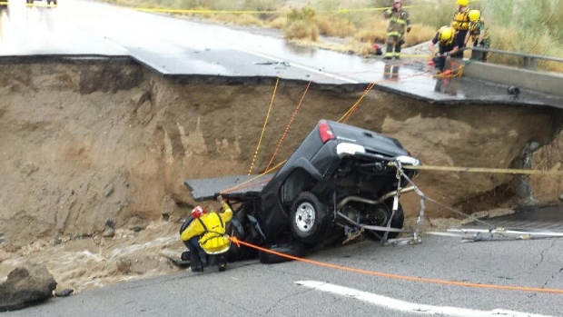 The bridge which carries the eastbound interstate above a normally dry wash snapped and ended up in the flooding water below the California Highway Patrol said