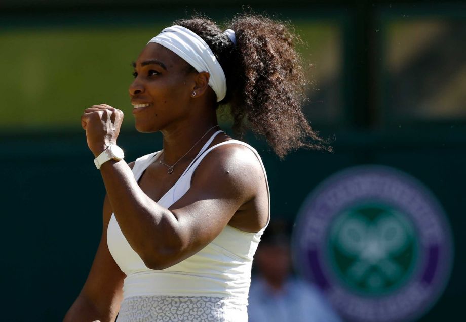 Serena Williams of the United States celebrates as she defeats Maria Sharapova of Russia in their women's singles semifinal match at the All England Lawn Tennis Championships in Wimbledon London Thursday