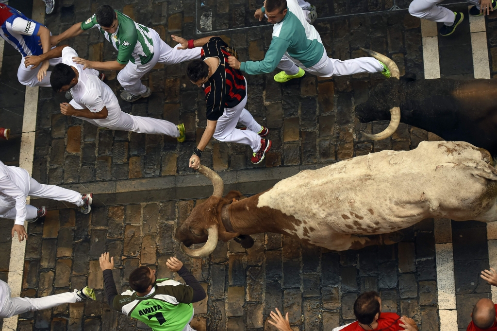 A ''recortador'&#039 jumps over a bull during a competition at the San Fermin festival in Pamplona Spain Saturday