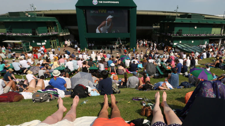 Spectators enjoying Henman Hill on the hottest ever day at Wimbledon